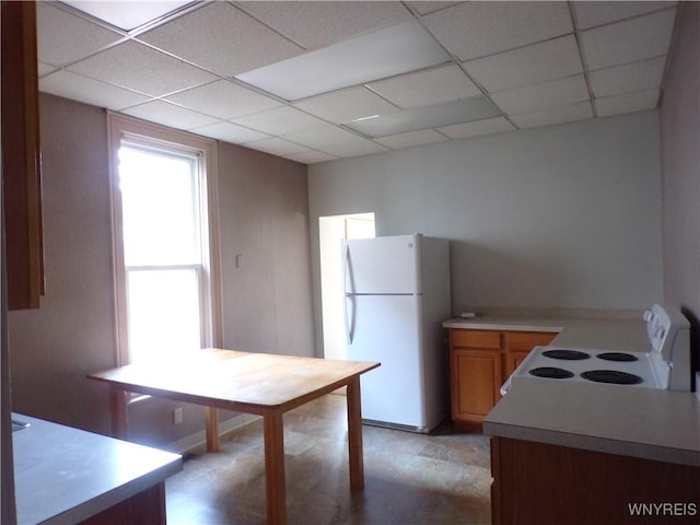 315 Laurens St, Olean-City, NY 14760 - kitchen featuring white appliances, a paneled ceiling, and light countertops