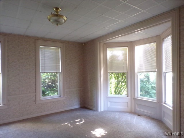 315 Laurens St, Olean-City, NY 14760 - unfurnished room featuring plenty of natural light, carpet flooring, and wallpapered walls