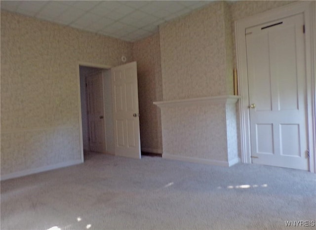 315 Laurens St, Olean-City, NY 14760 - carpeted empty room with wallpapered walls