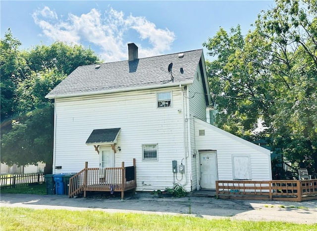 26 Kohlman St, Rochester, NY 14621 - rear view of property featuring a chimney and a shingled roof