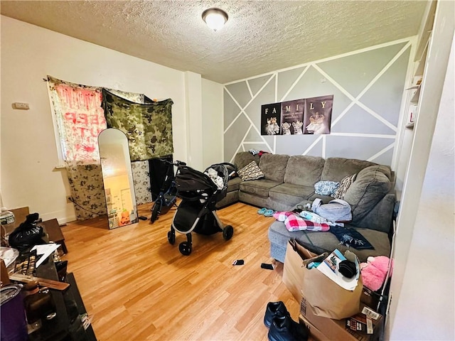 26 Kohlman St, Rochester, NY 14621 - living area featuring wood finished floors and a textured ceiling