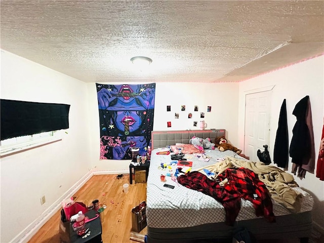 26 Kohlman St, Rochester, NY 14621 - bedroom featuring wood finished floors and a textured ceiling