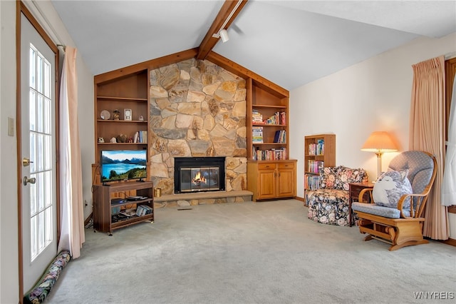 83 Randwood Dr, Amherst, NY 14068 - carpeted living area with a stone fireplace and built in features