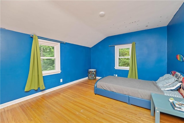 917 Whalen Rd, Penfield, NY 14526 - bedroom featuring wood finished floors and vaulted ceiling