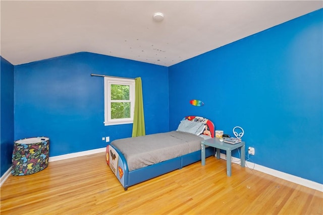 917 Whalen Rd, Penfield, NY 14526 - bedroom featuring wood finished floors and lofted ceiling