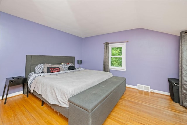 917 Whalen Rd, Penfield, NY 14526 - bedroom with wood finished floors and lofted ceiling