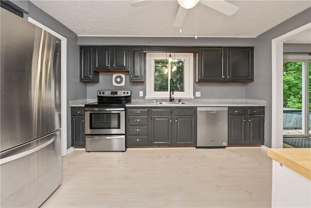 917 Whalen Rd, Penfield, NY 14526 - kitchen featuring stainless steel appliances, light countertops, light wood-style floors, and ceiling fan