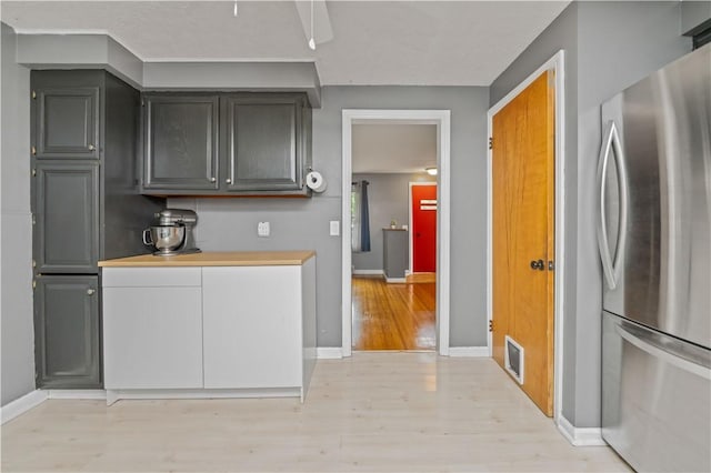 917 Whalen Rd, Penfield, NY 14526 - kitchen featuring freestanding refrigerator, light wood-style floors, and light countertops
