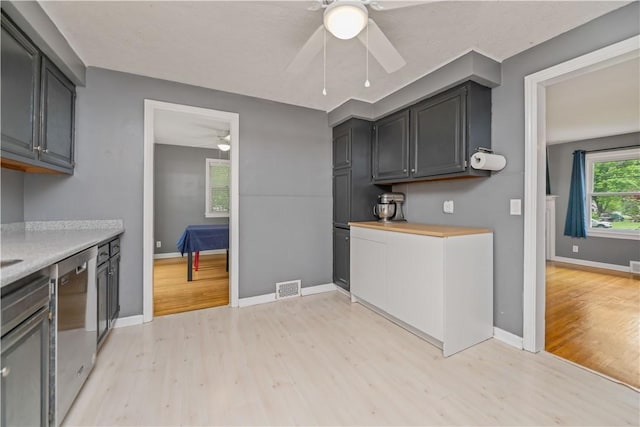 917 Whalen Rd, Penfield, NY 14526 - kitchen with a ceiling fan, light wood-style flooring, dishwasher, and light countertops