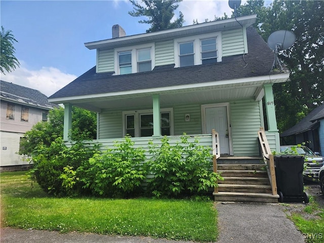 609 W Colvin St, Syracuse, NY 13205 - bungalow with a porch, a chimney, and roof with shingles