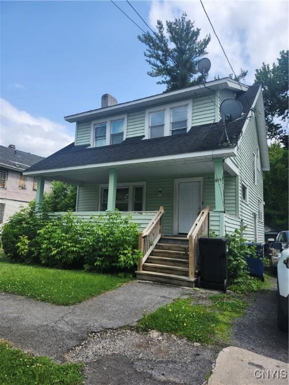 609 W Colvin St, Syracuse, NY 13205 - view of front of home featuring a porch and a chimney