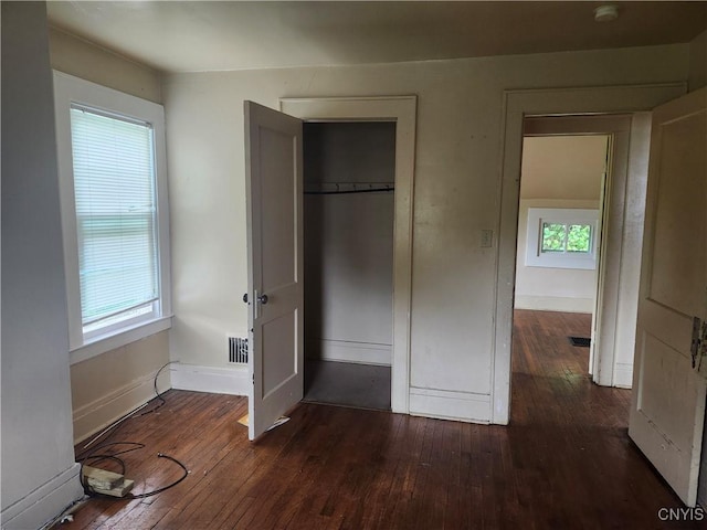 609 W Colvin St, Syracuse, NY 13205 - unfurnished bedroom featuring hardwood / wood-style flooring and a closet