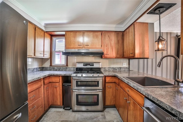 218 Hamilton Dr, Amherst, NY 14226 - kitchen featuring appliances with stainless steel finishes, under cabinet range hood, brown cabinets, decorative backsplash, and crown molding