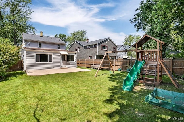 218 Hamilton Dr, Amherst, NY 14226 - rear view of house with a playground, a patio, and a fenced backyard