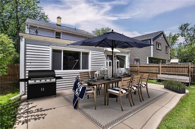 218 Hamilton Dr, Amherst, NY 14226 - rear view of house with a patio, outdoor dining area, and a chimney
