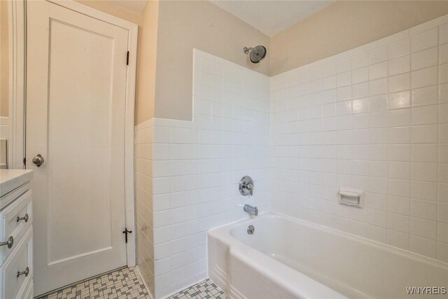 218 Hamilton Dr, Amherst, NY 14226 - full bathroom featuring vanity, tile walls, and wainscoting