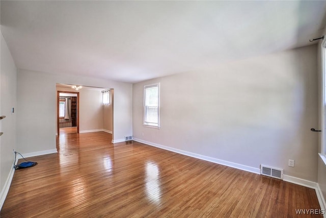 218 Hamilton Dr, Amherst, NY 14226 - empty room with healthy amount of natural light and wood finished floors