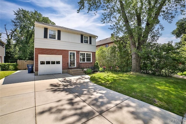 218 Hamilton Dr, Amherst, NY 14226 - traditional home featuring driveway, brick siding, and a garage