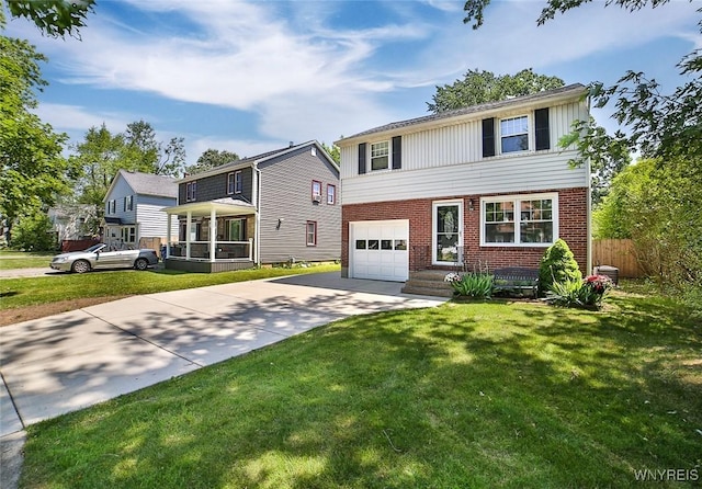 218 Hamilton Dr, Amherst, NY 14226 - view of front facade featuring concrete driveway, brick siding, and an attached garage