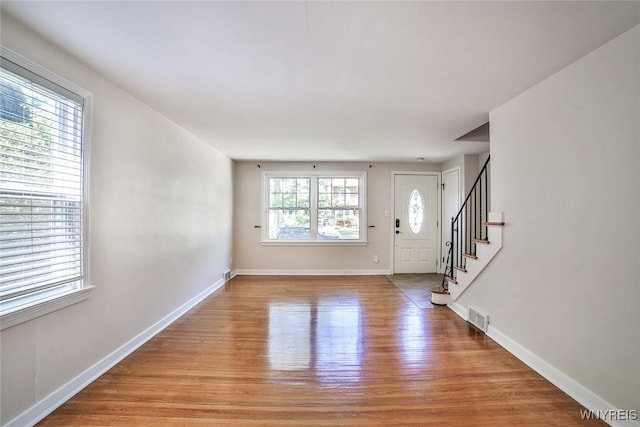 218 Hamilton Dr, Amherst, NY 14226 - entryway featuring light wood-type flooring and stairway