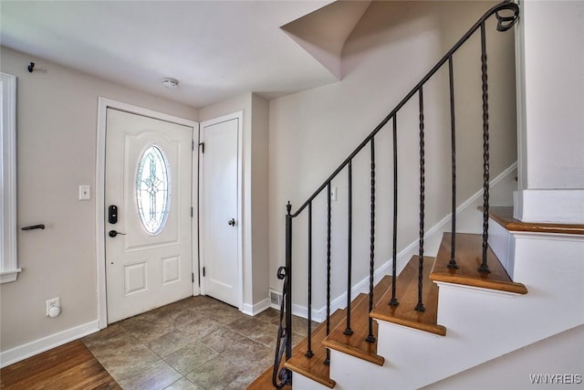 218 Hamilton Dr, Amherst, NY 14226 - entrance foyer featuring baseboards and stairway