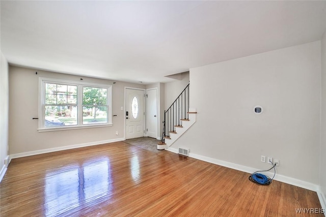 218 Hamilton Dr, Amherst, NY 14226 - entryway featuring wood finished floors and stairway