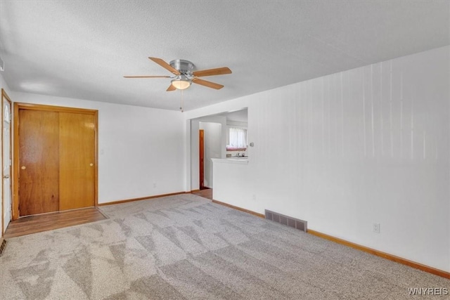 190 Gary Ln, Cheektowaga, NY 14227 - carpeted spare room with a ceiling fan and baseboards