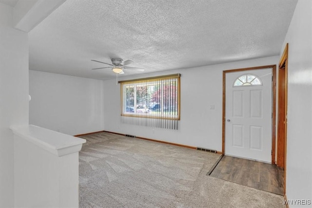 190 Gary Ln, Cheektowaga, NY 14227 - carpeted entrance foyer featuring healthy amount of natural light, a ceiling fan, and a textured ceiling