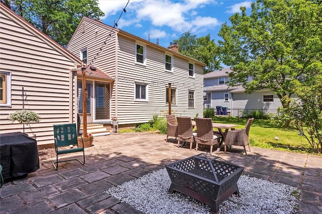 15 Baycrest Dr, Irondequoit, NY 14622 - view of patio featuring entry steps, an outdoor fire pit, area for grilling, and outdoor dining space