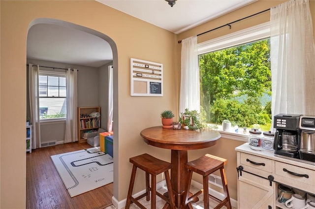 15 Baycrest Dr, Irondequoit, NY 14622 - dining space with arched walkways and wood finished floors
