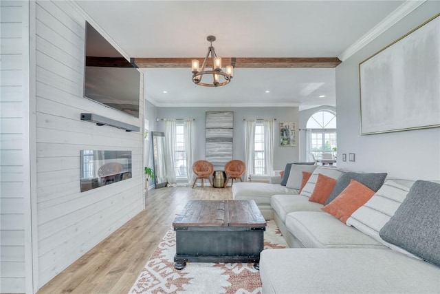 28 Blaydon Loop, Henrietta, NY 14586 - living room featuring a chandelier, wood finished floors, recessed lighting, ornamental molding, and a fireplace