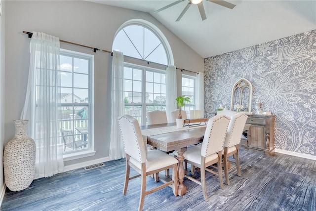 28 Blaydon Loop, Henrietta, NY 14586 - dining room with wallpapered walls, an accent wall, a ceiling fan, wood finished floors, and high vaulted ceiling