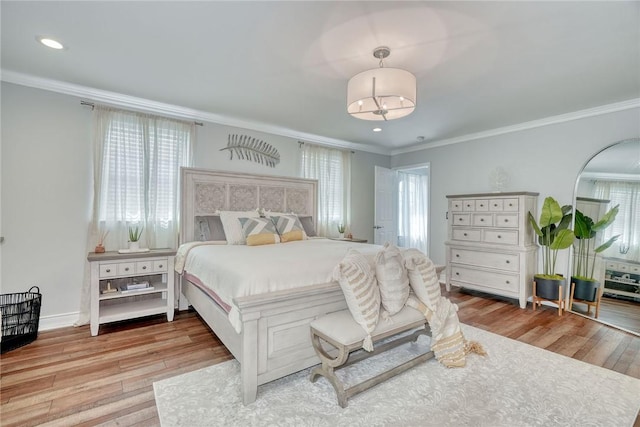 28 Blaydon Loop, Henrietta, NY 14586 - bedroom featuring crown molding, wood finished floors, recessed lighting, and a chandelier