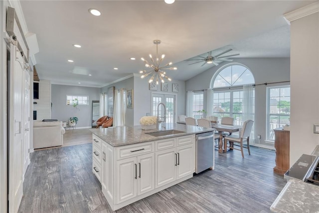 28 Blaydon Loop, Henrietta, NY 14586 - kitchen with stainless steel dishwasher, open floor plan, white cabinetry, wood finished floors, and healthy amount of natural light