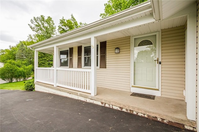 45 Barnfield Rd, Henrietta, NY 14534 - doorway to property featuring covered porch