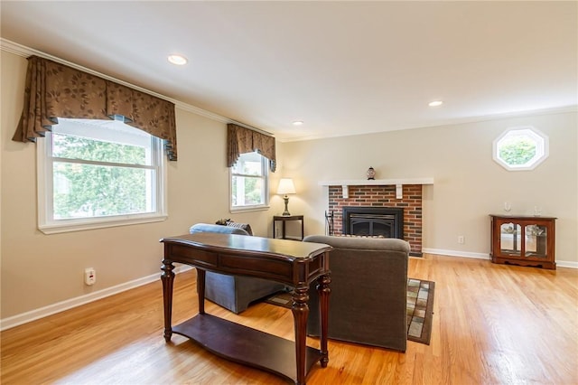 45 Barnfield Rd, Henrietta, NY 14534 - living area with plenty of natural light, light wood finished floors, a fireplace, crown molding, and recessed lighting