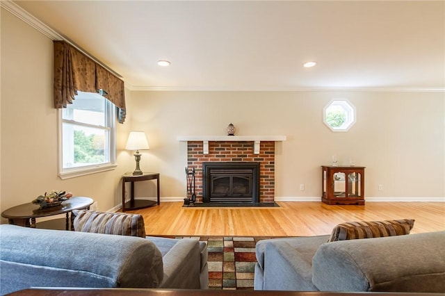 45 Barnfield Rd, Henrietta, NY 14534 - living room featuring ornamental molding, wood finished floors, a brick fireplace, and recessed lighting