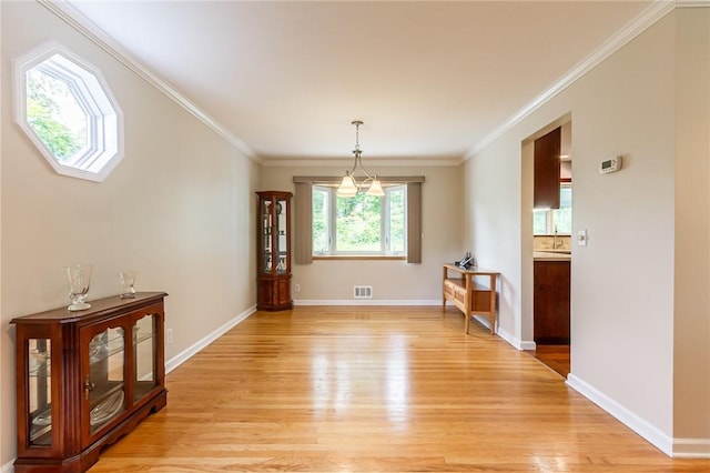45 Barnfield Rd, Henrietta, NY 14534 - dining room with light wood-style flooring and ornamental molding