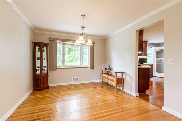 45 Barnfield Rd, Henrietta, NY 14534 - spare room with light wood-style floors and ornamental molding