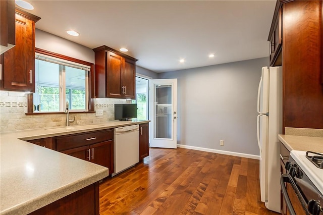 45 Barnfield Rd, Henrietta, NY 14534 - kitchen featuring white appliances, tasteful backsplash, dark wood-style floors, light countertops, and recessed lighting