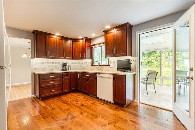 45 Barnfield Rd, Henrietta, NY 14534 - kitchen with white appliances, light countertops, light wood-style floors, decorative backsplash, and recessed lighting