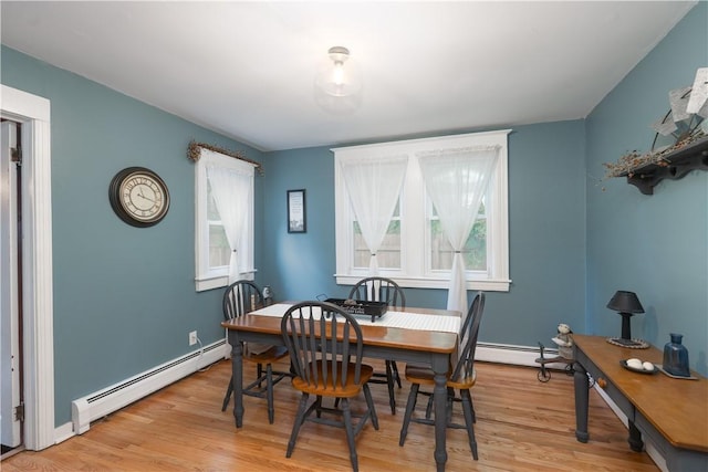 70 E Main St, Avon, NY 14414 - dining room featuring a baseboard heating unit and light wood finished floors