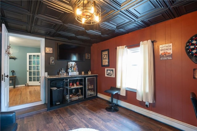 70 E Main St, Avon, NY 14414 - bar area featuring an ornate ceiling, dark wood-style floors, and baseboard heating