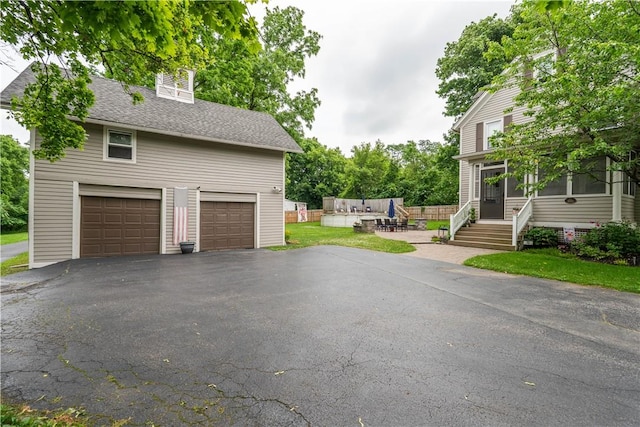 70 E Main St, Avon, NY 14414 - garage featuring driveway
