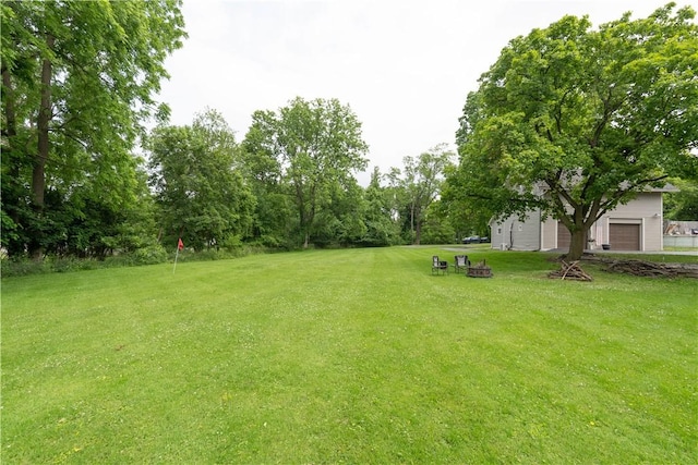 70 E Main St, Avon, NY 14414 - view of grassy yard featuring an outdoor fire pit