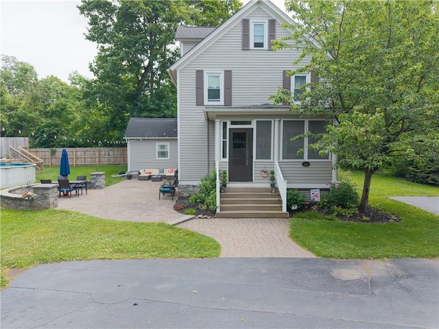 70 E Main St, Avon, NY 14414 - traditional style home with a fire pit, a patio area, and a sunroom