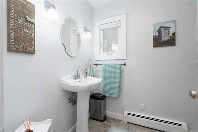 70 E Main St, Avon, NY 14414 - bathroom with a baseboard heating unit and wood finished floors