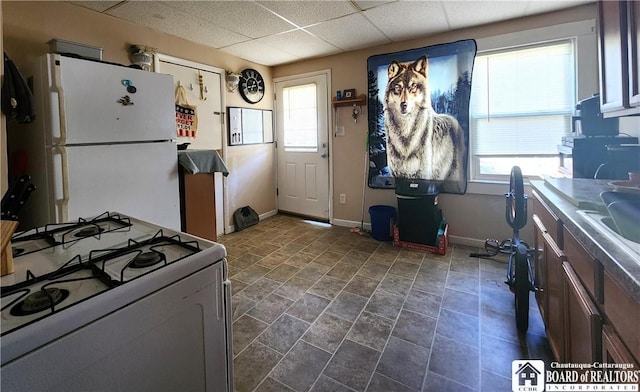 296 Falconer St, Jamestown, NY 14701 - kitchen with white appliances, plenty of natural light, and a drop ceiling