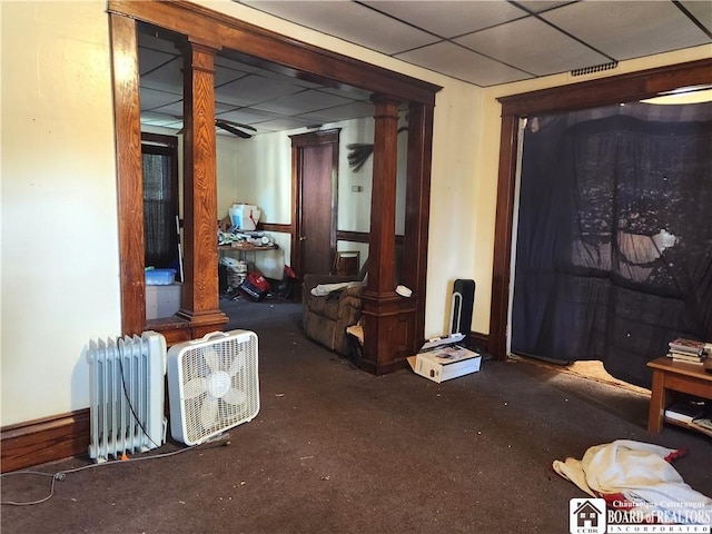 296 Falconer St, Jamestown, NY 14701 - below grade area with radiator heating unit, a paneled ceiling, and carpet floors