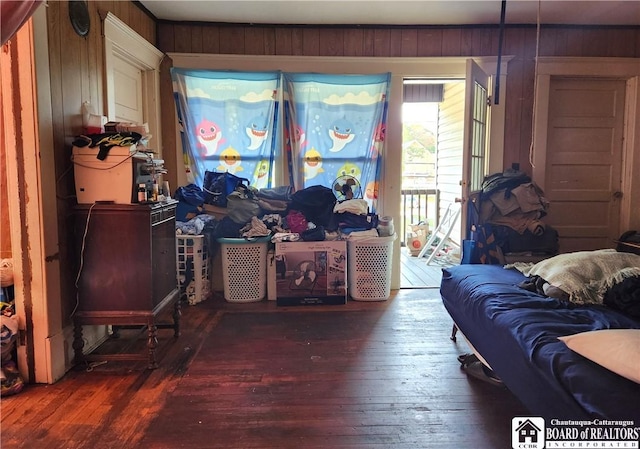 296 Falconer St, Jamestown, NY 14701 - living room with wood-type flooring and wood walls